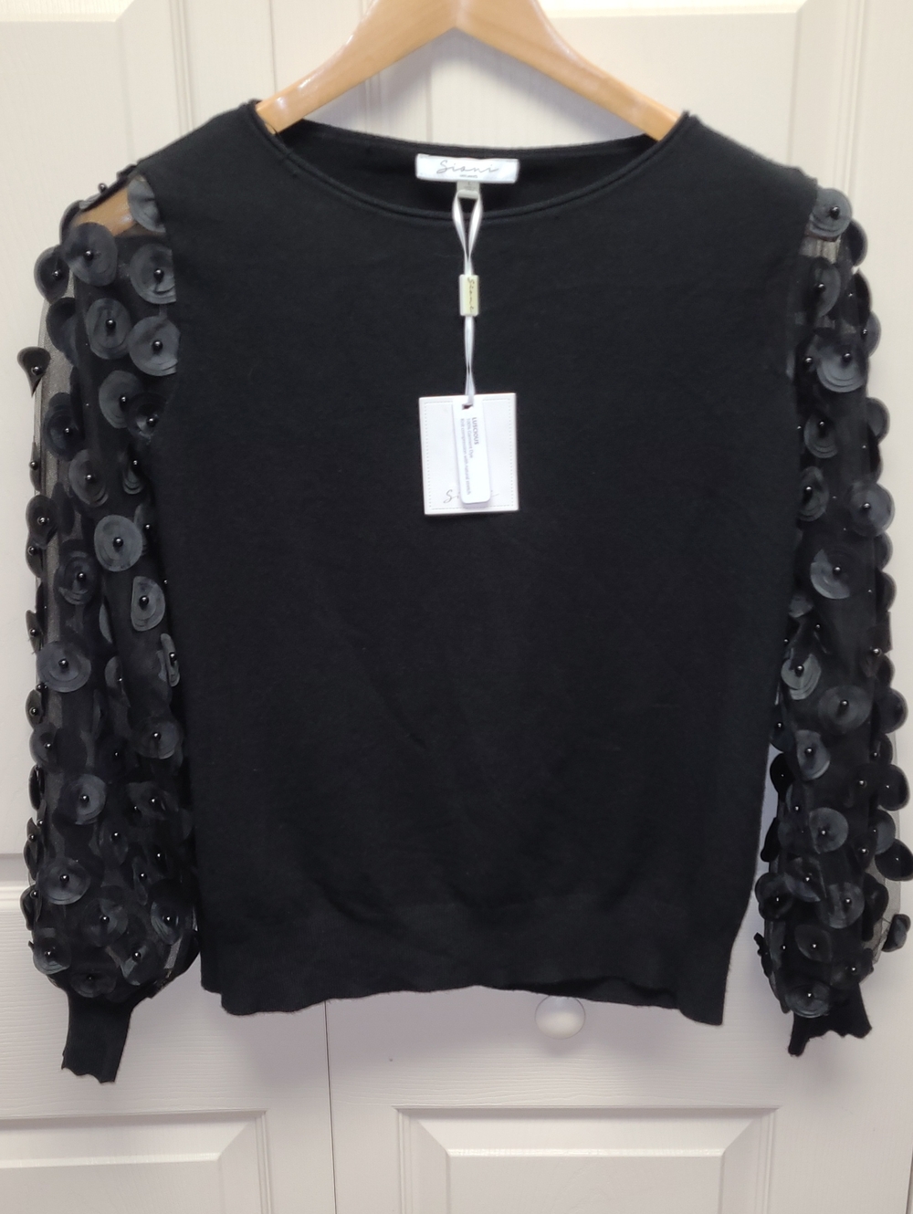 NWT Black Sheer mesh sleeves w/ beaded circular appliques Contemporary Sweater